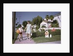 Mother and Son Walking by Christmas Decorations on Yards by Anonymous