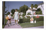 Mother and Son Walking by Christmas Decorations on Yards by Anonymous
