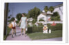 Mother and Son Walking by Christmas Decorations on Yards by Anonymous