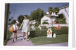 Mother and Son Walking by Christmas Decorations on Yards by Anonymous