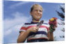 Girl Holding Cut Flowers by Anonymous
