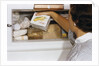 Woman Holding Box of Frozen Corn by Anonymous