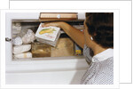 Woman Holding Box of Frozen Corn by Anonymous