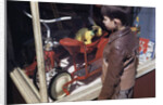 Boy Window Shopping at a Toystore by Anonymous