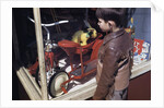 Boy Window Shopping at a Toystore by Anonymous