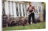 Boy Unhappily Mowing Lawn by Anonymous