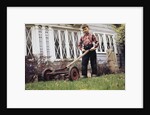 Boy Unhappily Mowing Lawn by Anonymous