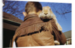 Boy Carrying Rabbit by Anonymous