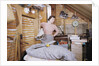 Woman Standing in an Attic by Anonymous