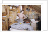 Woman Standing in an Attic by Anonymous
