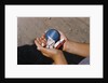 Child Holding Toys by Anonymous