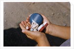 Child Holding Toys by Anonymous