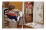 Boy Brushing His Suit Jacket by Anonymous