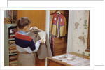 Boy Brushing His Suit Jacket by Anonymous