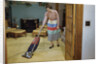 Woman Vacuuming Living Room by Anonymous