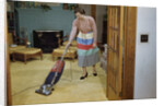 Woman Vacuuming Living Room by Anonymous