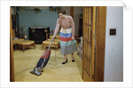 Woman Vacuuming Living Room by Anonymous