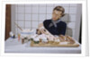 Woman Decorating Cup Cakes by Anonymous