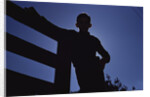 Silhouette of Boy Leaning Against Fence by Anonymous