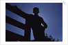 Silhouette of Boy Leaning Against Fence by Anonymous
