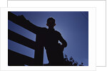 Silhouette of Boy Leaning Against Fence by Anonymous