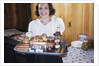 Girl Carrying Tray of Barbecue Items by Anonymous
