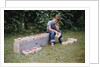 Bored Child Sitting with Raspberry Cartons by Anonymous