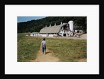 Boy Walking Towards a Barn by Anonymous