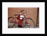 Boy Cleaning His Bike by Anonymous