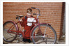 Boy Cleaning His Bike by Anonymous