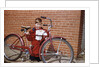 Boy Cleaning His Bike by Anonymous