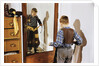 Boy Trying on Cowboy Duds by Anonymous