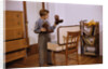 Boy Looking at Cowboy Boots by Anonymous