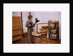 Boy Looking at Cowboy Boots by Anonymous