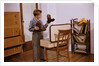 Boy Looking at Cowboy Boots by Anonymous