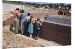 Family Observing a School Construction Site by Anonymous