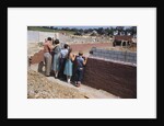 Family Observing a School Construction Site by Anonymous
