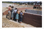 Family Observing a School Construction Site by Anonymous