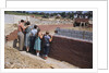 Family Observing a School Construction Site by Anonymous