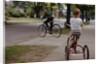 Boys Riding Their Bike and Tricycle by Anonymous