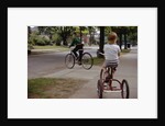 Boys Riding Their Bike and Tricycle by Anonymous