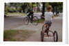 Boys Riding Their Bike and Tricycle by Anonymous