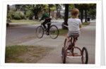 Boys Riding Their Bike and Tricycle by Anonymous