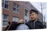 Boy Standing in Schoolyard by Anonymous