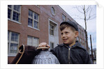 Boy Standing in Schoolyard by Anonymous