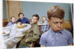 Boy Pouting near the Dinner Table by Anonymous