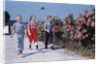 Children Walking Along Gravel Road by Anonymous