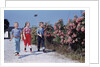 Children Walking Along Gravel Road by Anonymous