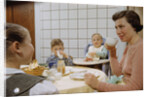 Mother and Daughter Conversing at Dinner Table by Anonymous