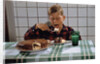 Boy Eating a Slice of Cake by Anonymous